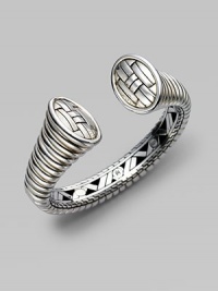 From the Bedeg Collection. A bold and sleek ribbed cuff, gracefully tapered, with a woven pattern on the end caps and a hidden hinge on one side.Sterling silver Diameter, about 2½ Width, about ¾ Hinged Made in Bali From the Bedeg Collection. A bold and sleek ribbed cuff, gracefully tapered, with a woven pattern on the end caps and a hidden hinge on one side.Sterling silver Diameter, about 2½ Width, about ¾ Hinged Made in Bali
