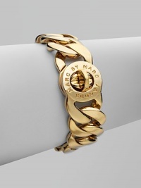 A logo engraved, chain link design. Brass Turnlock closure Length, about 8 Width, about ¾ Imported A logo engraved, chain link design. Brass Turnlock closure Length, about 8 Width, about ¾ Imported
