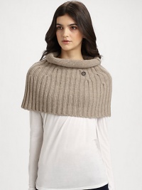 A plush, knit wool and cashmere topper with rolled collar in a cozy, cropped silhouette.About 15 X 1770% wool/30% cashmereDry cleanMade in Italy