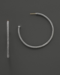Signature sterling silver Caviar™ beaded earrings, designed by Lagos. Signature sterling silver Caviar™ beaded earrings, designed by Lagos.