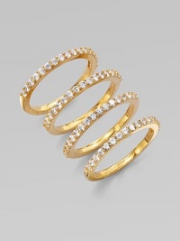 A set of four goldtone rings accented with sparkling cubic zirconia. Goldtone brassCubic zirconiaWidth, about ¼ when worn togetherImported A set of four goldtone rings accented with sparkling cubic zirconia. Goldtone brassCubic zirconiaWidth, about ¼ when worn togetherImported