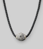 Stunning texture enlivens a gleaming silver pendant strung on braided leather. Sterling silver ¾ X 1 Necklace, about 18 Imported