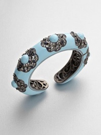 A pretty floral design embellished with glittering, multi-colored sapphires on a enamel coated bangle. Multi-colored sapphiresEnamelRhodium-platedDiameter, about 2.2Kick closureImported A pretty floral design embellished with glittering, multi-colored sapphires on a enamel coated bangle. Multi-colored sapphiresEnamelRhodium-platedDiameter, about 2.2Kick closureImported