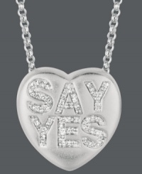 Ready to say your I do's? Sweethearts' adorable heart-shaped pendant expresses more that just great style with the words SAY YES spelled out in round-cut diamonds (1/6 ct. t.w.) across the surface. Pendant crafted in sterling silver. Copyright © 2011 New England Confectionery Company. Approximate length: 16 inches + 2-inch extender. Approximate drop: 5/8 inch. Ready to say your I do's? Sweethearts' adorable heart-shaped pendant expresses more that just great style with the words SAY YES spelled out in round-cut diamonds (1/6 ct. t.w.) across the surface. Pendant crafted in sterling silver. Copyright © 2011 New England Confectionery Company. Approximate length: 16 inches + 2-inch extender. Approximate drop: 5/8 inch.