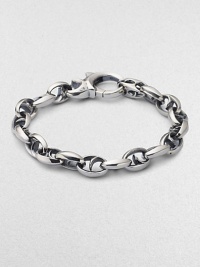 Bold oval links of polished sterling silver have not-so-sinister curved spikes in their centers.Sterling silver Length, about 8½ Lobster clasp Imported Bold oval links of polished sterling silver have not-so-sinister curved spikes in their centers.Sterling silver Length, about 8½ Lobster clasp Imported