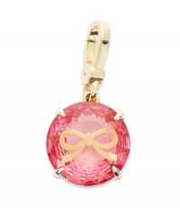 Juicy Couture's pretty charm features a round-cut solitaire pink epoxy stone engraved with a small bow. Set in a four prong gold tone brass setting. Lobster clasp closure. Approximate drop: 1-1/2 inches. Juicy Couture's pretty charm features a round-cut solitaire pink epoxy stone engraved with a small bow. Set in a four prong gold tone brass setting. Lobster clasp closure. Approximate drop: 1-1/2 inches.