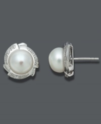 Polished to perfection. Always classy, these stunning studs highlight cultured freshwater pearls (9-10 mm) surrounded by a diamond-accented petal design set in sterling silver. Approximate diameter: 1/2 inch. Polished to perfection. Always classy, these stunning studs highlight cultured freshwater pearls (9-10 mm) surrounded by a diamond-accented petal design set in sterling silver. Approximate diameter: 1/2 inch.