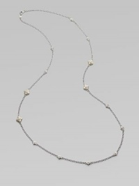 From the Windsor Collection. A long and lovely chain of textured oval links is sprinkled with shapely little medallions sparked white sapphires. White sapphires Sterling silver and 18k yellow gold Length, about 34 Lobster clasp Imported From the Windsor Collection. A long and lovely chain of textured oval links is sprinkled with shapely little medallions sparked white sapphires. White sapphires Sterling silver and 18k yellow gold Length, about 34 Lobster clasp Imported