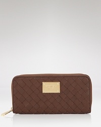 MICHAEL Michael Kors' wallet is a covet-worthy way to organize your daytime essentials. This piece features rich leather for tactile luxury, punctuated by the brand's signature hardware. MICHAEL Michael Kors' wallet is a covet-worthy way to organize your daytime essentials. This piece features rich leather for tactile luxury, punctuated by the brand's signature hardware.