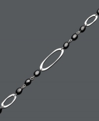 Decorate your wrist with the perfect finishing touch. This chic bracelet features a cut-out oval design accented by onyx beads (6 mm x 4 mm). Set in sterling silver. Approximate length: 7 inches.