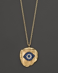 Brilliant blue sapphires and diamonds form a traditional evil eye charm, set in organically shaped 14K. yellow gold. By Meira T. Brilliant blue sapphires and diamonds form a traditional evil eye charm, set in organically shaped 14K. yellow gold. By Meira T.