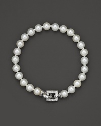 A cultured, freshwater pearl bracelet with a square, diamond clasp. A cultured, freshwater pearl bracelet with a square, diamond clasp.