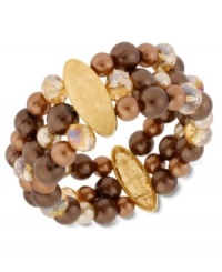 Quite a stretch. Kenneth Cole New York's stretch bracelet is crafted from gold-tone mixed metal with oval accents, as well as rows of brown glass pearls and beads for a stunning statement. Item comes packaged in a signature Kenneth Cole New York Gift Box. Approximate length: 7-1/2 inches. Approximate width: 1-1/5 inches. Quite a stretch. Kenneth Cole New York's stretch bracelet is crafted from gold-tone mixed metal with oval accents, as well as rows of brown glass pearls and beads for a stunning statement. Item comes packaged in a signature Kenneth Cole New York Gift Box. Approximate length: 7-1/2 inches. Approximate width: 1-1/5 inches.