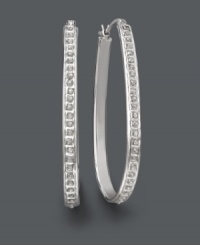 Seamless sparkle for timeless style. These fashionable hoop earrings shine with the addition of round-cut diamond accents. Crafted in sterling silver. Approximate diameter: 1-3/4 inches. Seamless sparkle for timeless style. These fashionable hoop earrings shine with the addition of round-cut diamond accents. Crafted in sterling silver. Approximate diameter: 1-3/4 inches.