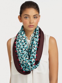 A graphic style with a fun pom-pom trim. 75% viscose/25% woolAbout 19 X 75Dry cleanImported A graphic style with a fun pom-pom trim. 75% viscose/25% woolAbout 19 X 75Dry cleanImported