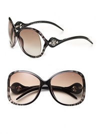 Tubular acetate frames with open lens is adorned with a signature Cavalli emblem at temple. Available in gradient black on zebra with brown gradient lens or palladium/pearl brown with brown gradient lens. 100% UV protection Made in Italy Tubular acetate frames with open lens is adorned with a signature Cavalli emblem at temple. Available in gradient black on zebra with brown gradient lens or palladium/pearl brown with brown gradient lens. 100% UV protection Made in Italy