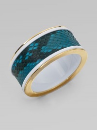 A wide strip on luxurious python sandwiched in glossy resin with a 14k goldplated border. PythonResin14K goldplatedDiameter, about 3¼Slip-on styleMade in USA A wide strip on luxurious python sandwiched in glossy resin with a 14k goldplated border. PythonResin14K goldplatedDiameter, about 3¼Slip-on styleMade in USA