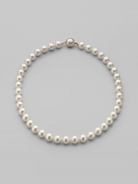 A classic strand of white organic man-made pearls is essential elegance. 10mm white round pearls Length, about 18 18k gold vermeil and mabé pearl push-lock clasp Made in Spain