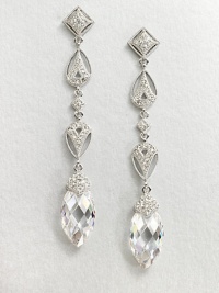 This refined piece features a long drop consisting of various shapes accented in pavé crystals, culminating in a faceted cubic zirconia stone. CrystalsCubic zirconiaRhodium-plated brassLength, about 2.5Post backImported This refined piece features a long drop consisting of various shapes accented in pavé crystals, culminating in a faceted cubic zirconia stone. CrystalsCubic zirconiaRhodium-plated brassLength, about 2.5Post backImported