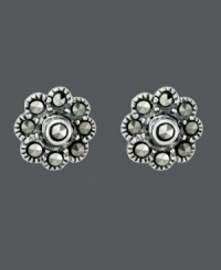 Sweeten your style just in time for warm weather seasons. Flower-shaped Genevieve & Grace stud earrings shine with the addition of round-cut marcasite accents. Crafted in sterling silver. Approximate diameter: 1/4 inch. Sweeten your style just in time for warm weather seasons. Flower-shaped Genevieve & Grace stud earrings shine with the addition of round-cut marcasite accents. Crafted in sterling silver. Approximate diameter: 1/4 inch.