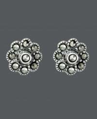 Sweeten your style just in time for warm weather seasons. Flower-shaped Genevieve & Grace stud earrings shine with the addition of round-cut marcasite accents. Crafted in sterling silver. Approximate diameter: 1/4 inch.