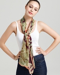 A sheer oblong scarf featuring a gorgeous tropical flora print and signature logo at hem. A sheer oblong scarf featuring a gorgeous tropical flora print and signature logo at hem.