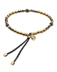 This Michael Kors bracelet stretches to fit and features adjustable leather ties for comfort. The beaded design will fit in well when layered with your other favorite bangles. Stack them up! This Michael Kors bracelet stretches to fit and features adjustable leather ties for comfort. The beaded design will fit in well when layered with your other favorite bangles. Stack them up!