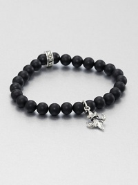 A delicate fleur de lis of sterling silver and a signature logo charm accents a simple, yet masculine strand of black onyx beads.Sterling silverBlack onyxWidth, about 8mmDiameter, about 3Made in USA A delicate fleur de lis of sterling silver and a signature logo charm accents a simple, yet masculine strand of black onyx beads.Sterling silverBlack onyxWidth, about 8mmDiameter, about 3Made in USA