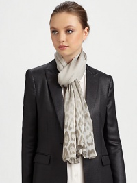 A semi-sheer stain, Shankara denim wrap with a leopard printed border on luxe silk.SilkAbout 70 X 180Dry cleanMade in Italy A semi-sheer stain, Shankara denim wrap with a leopard printed border on luxe silk.SilkAbout 70 X 180Dry cleanMade in Italy