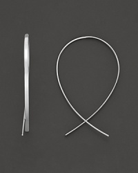 A gracefully-arching upside hoop earring in 14 Kt. white gold. A gracefully-arching upside hoop earring in 14 Kt. white gold.