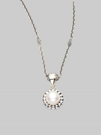 From the Luna Collection. A round pearl pendant with fluted border is suspended on an adjustable chain link.Pearl Sterling silver Length, about 16 - 18 Pendant width, about ½ Pendant length, about 1 Lobster clasp closure Imported From the Luna Collection. A round pearl pendant with fluted border is suspended on an adjustable chain link.Pearl Sterling silver Length, about 16 - 18 Pendant width, about ½ Pendant length, about 1 Lobster clasp closure Imported