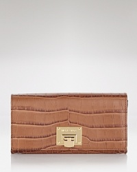 This effortless wallet captures the cosmopolitan essence of MICHAEL Michael Kors with its slim profile and sophisticated leather. This effortless wallet captures the cosmopolitan essence of MICHAEL Michael Kors with its slim profile and sophisticated leather.