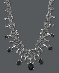 Please do elaborate. Your neckline will shine when adorned with Genevieve & Grace's unique, scrolling necklace. Pear-cut onyx (11-3/4 ct. t.w.) and glittering marcasite create an ultra-dramatic look. Crafted in sterling silver. Approximate length: 18 inches. Approximate drop: 9/16 inch. Please do elaborate. Your neckline will shine when adorned with Genevieve & Grace's unique, scrolling necklace. Pear-cut onyx (11-3/4 ct. t.w.) and glittering marcasite create an ultra-dramatic look. Crafted in sterling silver. Approximate length: 18 inches. Approximate drop: 9/16 inch.