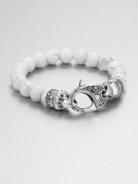 A new look for the modern man, handsomely crafted with a sterling silver raven's head clasp and a string of white coral beads.Sterling silverAbout 9 longAbout 3 diam.Lobster claspImported A new look for the modern man, handsomely crafted with a sterling silver raven's head clasp and a string of white coral beads.Sterling silverAbout 9 longAbout 3 diam.Lobster claspImported