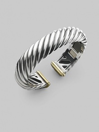 From the Carved Cable Collection. A bold cable cuff of sterling silver, richly accented with touches of 18k gold. Sterling silver and 18k yellow gold Cable, 15mm Diameter, about 2¼ Hinged Imported From the Carved Cable Collection. A bold cable cuff of sterling silver, richly accented with touches of 18k gold. Sterling silver and 18k yellow gold Cable, 15mm Diameter, about 2¼ Hinged Imported
