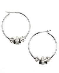 Take your look to another level in hoops earrings with extra shine. Nine West's chic style highlights polished discs with glass accents. Crafted in silver tone mixed metal. Approximate diameter: 1-1/4 inches. Take your look to another level in hoops earrings with extra shine. Nine West's chic style highlights polished discs with glass accents. Crafted in silver tone mixed metal. Approximate diameter: 1-1/4 inches.