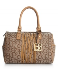 A classic, tailored satchel gets an updated look with eye-catching zebra accents in genuine leather. The soft shimmer of gold-tone hardware complements the signature jacquard fabric making this Calvin Klein carryall an essential for any season. A classic, tailored satchel gets an updated look with eye-catching zebra accents in genuine leather. The soft shimmer of gold-tone hardware complements the signature jacquard fabric making this Calvin Klein carryall an essential for any season.