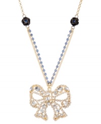 Top off your look to complete the package. Betsey Johnson's ultra-feminine pendant features a crystal-encrusted bow strung from a blue crystal cup chain with flower charm accents. Set in gold-plated mixed metal. Approximate length: 16 inches + 3-inch extender. Approximate drop: 2 inches. Top off your look to complete the package. Betsey Johnson's ultra-feminine pendant features a crystal-encrusted bow strung from a blue crystal cup chain with flower charm accents. Set in gold-plated mixed metal. Approximate length: 16 inches + 3-inch extender. Approximate drop: 2 inches.