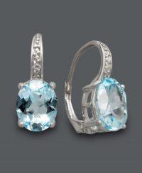 Need a color pick me up? These sparkling blue topaz earrings (7 ct. t.w.) by Victoria Townsend are the perfect pair to infuse your wardrobe. Crafted in sterling silver with sparkling diamond accents. Approximate drop: 3/4 inch. Need a color pick me up? These sparkling blue topaz earrings (7 ct. t.w.) by Victoria Townsend are the perfect pair to infuse your wardrobe. Crafted in sterling silver with sparkling diamond accents. Approximate drop: 3/4 inch.