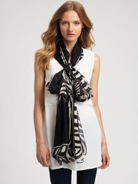 Dynamic roses and leaves crafted in a striking zebra print breathe life into a luxurious silk scarf.SilkAbout 28 X 110Dry cleanMade in Italy Dynamic roses and leaves crafted in a striking zebra print breathe life into a luxurious silk scarf.SilkAbout 28 X 110Dry cleanMade in Italy