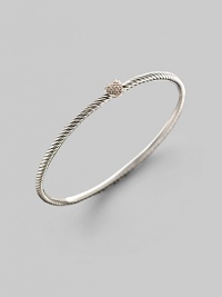 At the center of this slender sterling silver cable is a petite heart, delineated in diamonds. Diamonds, 0.11 tcw Sterling silver Diameter, about 2¼ Made in USA At the center of this slender sterling silver cable is a petite heart, delineated in diamonds. Diamonds, 0.11 tcw Sterling silver Diameter, about 2¼ Made in USA