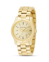 MICHAEL Michael Kors' shiny goldplated stainless steel watch has a light champagne super-fine sunray dial and shiny gold stick indices. MICHAEL Michael Kors' shiny goldplated stainless steel watch has a light champagne super-fine sunray dial and shiny gold stick indices.