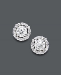 Style fit for a star. Wear this sparkling pair for any occasion, but be prepared to turn heads. Round-cut diamonds (1/2 ct. t.w.) shine amongst a halo of diamond accents. Crafted in 14k white gold. Approximate diameter: 6-2/10 mm. Style fit for a star. Wear this sparkling pair for any occasion, but be prepared to turn heads. Round-cut diamonds (1/2 ct. t.w.) shine amongst a halo of diamond accents. Crafted in 14k white gold. Approximate diameter: 6-2/10 mm.