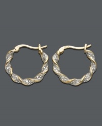 Simple hoops with a sparkling twist. Earrings by Victoria Townsend are crafted in 18k gold over sterling silver with round-cut diamond accents and a unique twisted design. Approximate diameter: 3/4 inch.