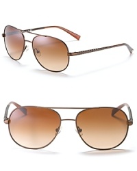 Tory Burch's aviator sunglasses have a 4 T-pattern engraved on temples. Adjustable nose pads help to secure fit. UV 400. Tory Burch's aviator sunglasses have a 4 T-pattern engraved on temples. Adjustable nose pads help to secure fit. UV 400.