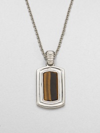 Shiny sterling silver frames a center tigers' eye stone, handsomely suspended from a link chain.Sterling silverTigers' eyeLength, about 22Pendant size, about 1 x ½Imported Shiny sterling silver frames a center tigers' eye stone, handsomely suspended from a link chain.Sterling silverTigers' eyeLength, about 22Pendant size, about 1 x ½Imported