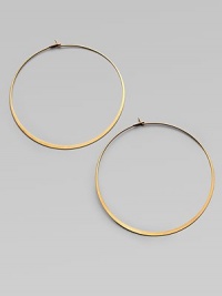 Make a quiet statement in these elegant hoop earrings. Goldtone metalLength, about 2.25Post closureImported 
