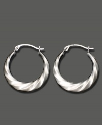 Shining swirls add dimension and texture to these 14k white gold hoop earrings. Approximate diameter: 1/2 inch. Shining swirls add dimension and texture to these 14k white gold hoop earrings. Approximate diameter: 1/2 inch.