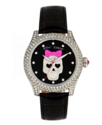 Cuteness to die for. Watch by Betsey Johnson crafted of black croc-embossed leather strap and round polished stainless steel case covered in crystal accents. Black dial features crystal accent markers, large silver tone skull with pink bow and crystal accents at center, silver tone hour and minute hands, signature fuchsia second hand and logo. Quartz movement. Water resistant to 30 meters. Two-year limited warranty. Cuteness to die for. Watch by Betsey Johnson crafted of black croc-embossed leather strap and round polished stainless steel case covered in crystal accents. Black dial features crystal accent markers, large silver tone skull with pink bow and crystal accents at center, silver tone hour and minute hands, signature fuchsia second hand and logo. Quartz movement. Water resistant to 30 meters. Two-year limited warranty.