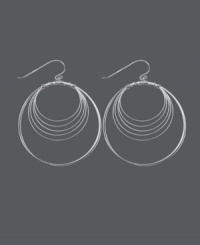 Get style that's out of this orbit! Chic, circular earrings by Unwritten feature a wire wrap design crafted in sterling silver. Approximate drop: 2-1/4 inches. Get style that's out of this orbit! Chic, circular earrings by Unwritten feature a wire wrap design crafted in sterling silver. Approximate drop: 2-1/4 inches.